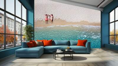 Summer holiday concept with a happy family relaxing on a beautiful beach with emerald sea, Cyclades, Greece Wall mural