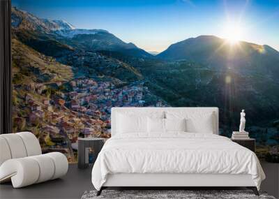 The popular village of Arachova, Boiotia, Greece, at the slopes of Parnassus mountain during a clear winter sunsrise Wall mural