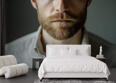 Close-up of a man with a prominent beard, wearing a stylish shirt Wall mural