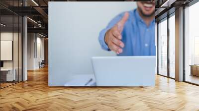 Banner panorama of smiling businessman entrepreneur manager or business partner offering hand for handshake in white office gives hand for handshake proposes partnership faceless mid body section Wall mural