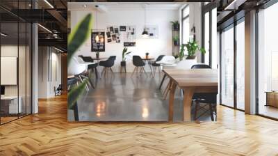 A large open room with a wooden table and chairs Wall mural