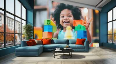 A young girl is playing with a large pile of colorful blocks Wall mural