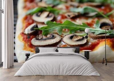 Delicious homemade pizza topped with mushrooms and arugula, perfect for a culinary delight. Wall mural