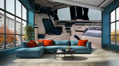 Luxury leather seats in the comfortable van. Interior of luxury minivan with backlight, transfer car Wall mural