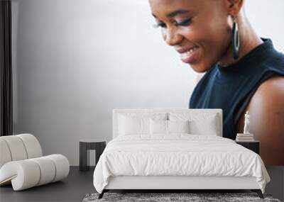 Bald african american woman using digital tablet computer at home Wall mural