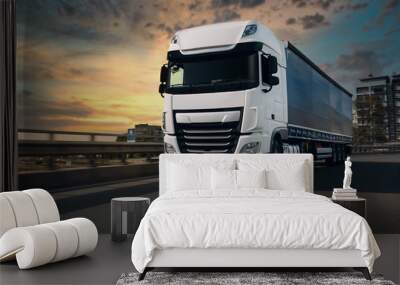 Semi-truck with cargo trailer driving at the city streets. Fast moving truck Wall mural