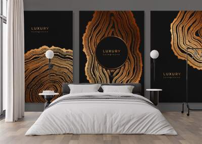 Set of templates. Luxury golden background with wood annual rings texture. Banner with tree ring pattern. Stamp of tree trunk in section. Natural wooden concentric circles. Black and bronze background Wall mural