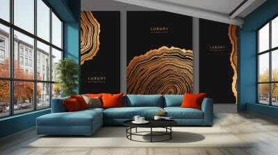 Set of templates. Luxury golden background with wood annual rings texture. Banner with tree ring pattern. Stamp of tree trunk in section. Natural wooden concentric circles. Black and bronze background Wall mural