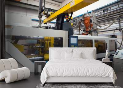 Injection molding machines in a large factory Wall mural