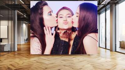 3 girls send kisses to the camera. Girls at the party, dancing, having fun, brunette models. Wall mural