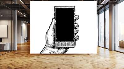 Smartphone hold male hand. Vintage drawn vector engraving illustration for info graphic, poster, web. Wall mural