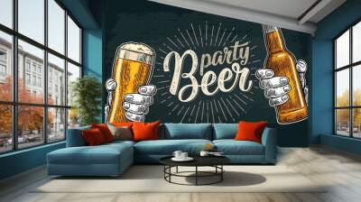 Two hands holding and clinking with beer glasses and bottle Wall mural