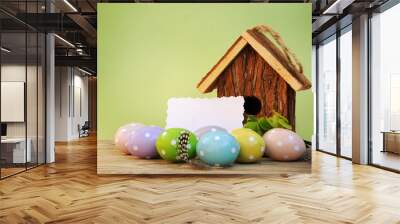 Easter eggs with tulips flowers and birdhouse Wall mural