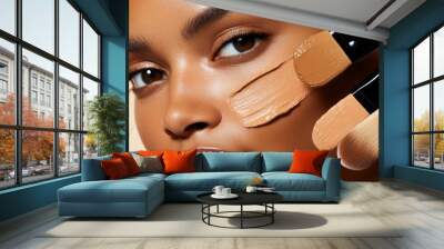 Close-up of a woman's face with foundation swatches and makeup brushes, showcasing various tones for perfect skin coverage. Wall mural