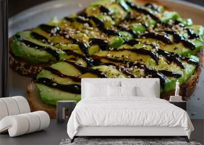 Two slices of avocado toast with a garnish of sprouts and seeds. Wall mural