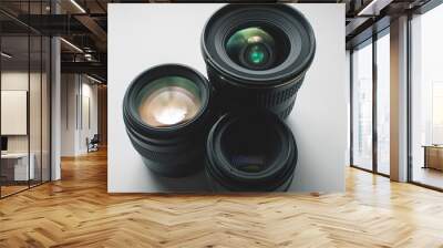 close-up view of a group of camera lenses on a white surface Wall mural