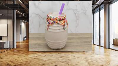 Sweet milk infused horchata with with colorful sprinkles coatiing the rim of the cup for a sweet beverage drink Wall mural