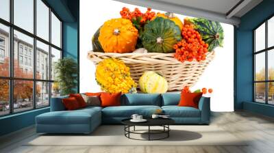 autumn pumpkins in a straw basket, isolated on the white backgro Wall mural