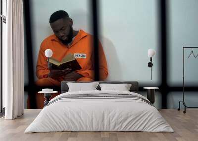 African-american prisoner reading holy bible, convicted sinner, religion Wall mural