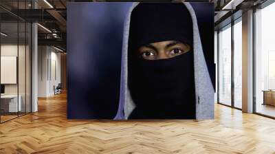 African bandit in balaclava mask preparing to commit crime at night, burglar Wall mural