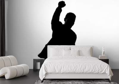 Businessman silhouette raises fist up, celebrates success, proud of achievement Wall mural