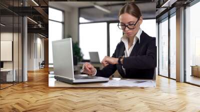 Busy woman looking at watch, confused by failing urgent task, missing deadline Wall mural