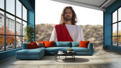 Jesus looking at camera, preaching Christian faith in desert, soul salvation Wall mural