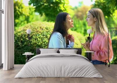 Two female friends arguing outdoors, relations confrontation, communication Wall mural