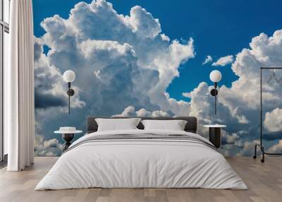 accumulated clouds in a bright sky Wall mural