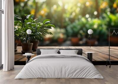 Wooden table top on blur background of green garden with bokeh sunlight. High quality photo
 Wall mural