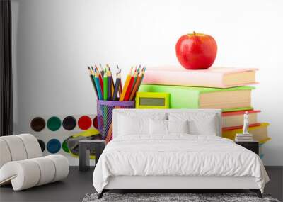 Multi coloured school books and stationery isolated on white background Wall mural