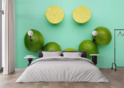 Smile lime on mint background. Top view Wall mural