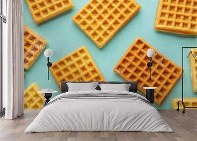 Waffles on blue background with copy space. Wall mural