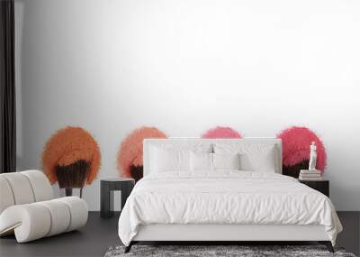 cosmetics makeup brushes with orange,pink and red powder. Wall mural