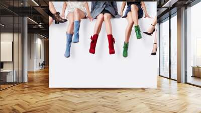 Many woman with colorful shoes sitting together.Fashion shopping image.  Wall mural