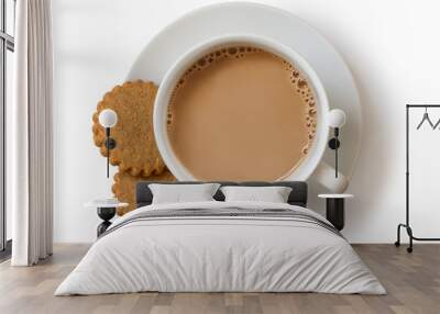 A cup of tea with milk and two gingerbread biscuits isolated on white from above. White ceramic cup and saucer. Wall mural