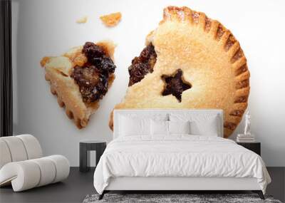 Broken open traditional british christmas mince pie with fruit filling isolated on white. Top view. Wall mural