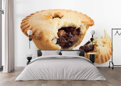 Broken open traditional british christmas mince pie with fruit filling isolated on white. Wall mural