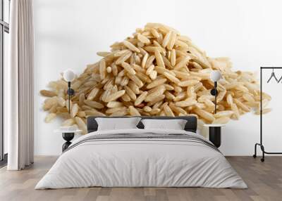 Pile of long grain brown rice isolated on white. Wall mural