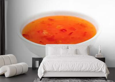 Sweet chilli sauce in a white ceramic bowl isolated on white. Wall mural