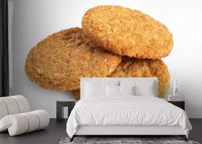 Three crunchy oat and wholemeal biscuits isolated on white. Wall mural