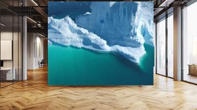 Close up aerial iceberg calving blue ocean water. Huge high snow covered ice formation floats sea bay. Polar winter landscape. Ecology, melting ice, climate change, global warming background. Drone Wall mural