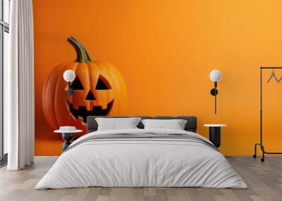 Funny evil pumpkin smiling on orange background. Halloween joyful decorative banner. Wall mural