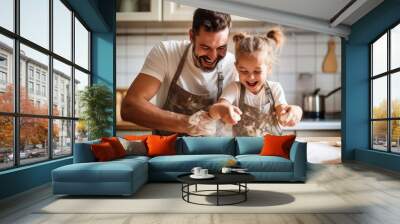 Happy father and daughter sharing a moment of joy in the family kitchen, preparing dough with flour, cooking together with complicity Wall mural