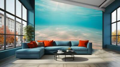 Seabed sand with blue tropical ocean above, empty underwater background with the summer sun shining brightly, creating ripples in the calm sea water Wall mural