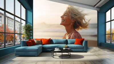 Smiling mature woman at the beach, natural lifestyle, enjoying the sunny weather Wall mural