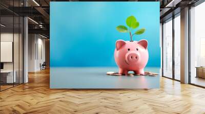 Smiling pink pig piggy bank, a stack of gold coins and a green plant growing, isolated on blue background. Investment success, savings concept - Generative AI Wall mural