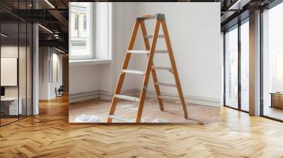 A wooden ladder positioned in a room, surrounded by paint buckets and cloths, ready for painting or renovation projects. Wall mural