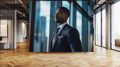 African-American businessman standing in the office and looking at the city. Created with Generative AI technology. Wall mural