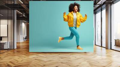 Full length body size view of attractive carefree girl dancing isolated over blue background Wall mural